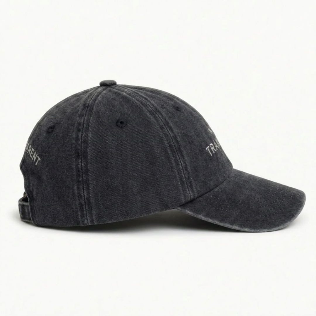Close-up of black washed cap fabric and off-white embroidery detail